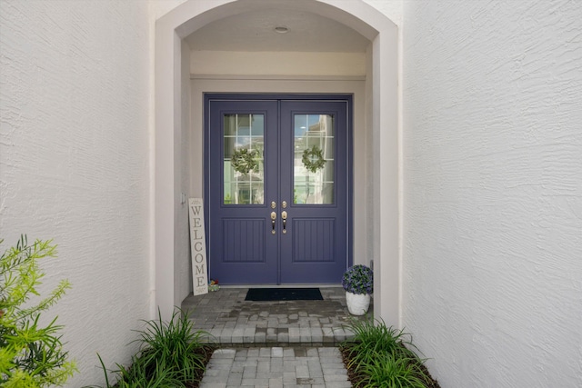 doorway to property featuring french doors