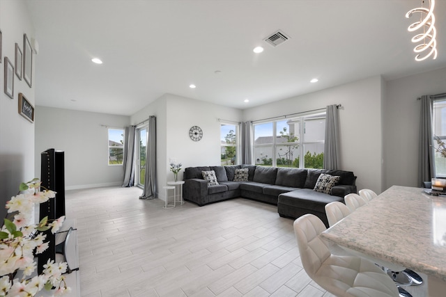 living room featuring light hardwood / wood-style floors and plenty of natural light