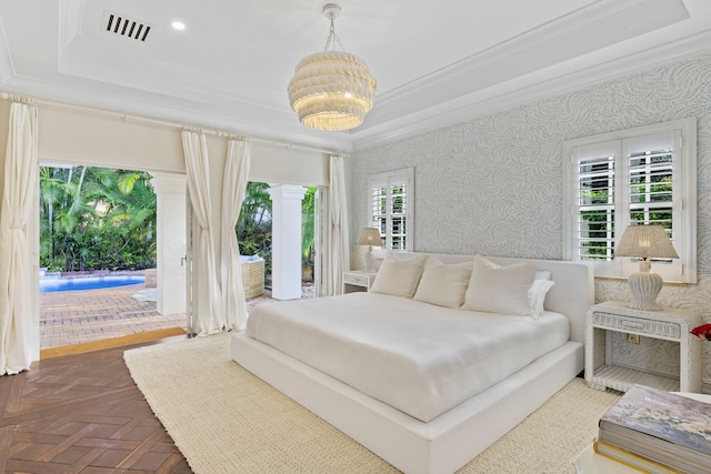 bedroom featuring a raised ceiling, dark parquet floors, and access to outside