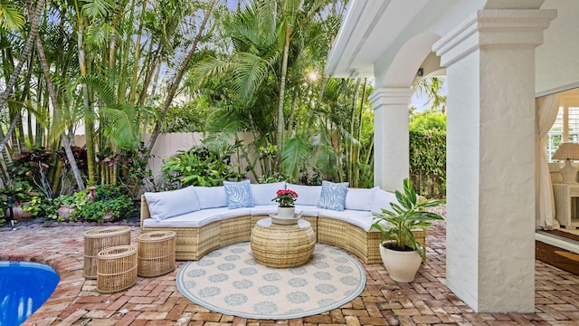 view of patio with an outdoor living space and a swimming pool