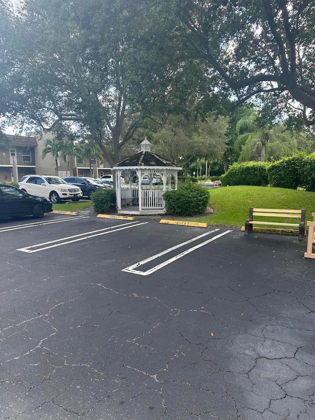 view of car parking featuring a gazebo