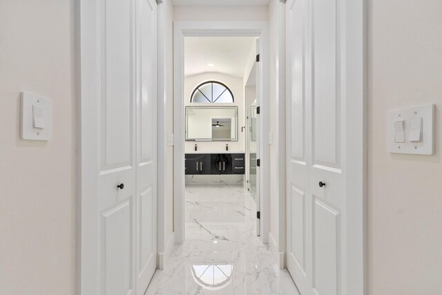 hall featuring a textured ceiling