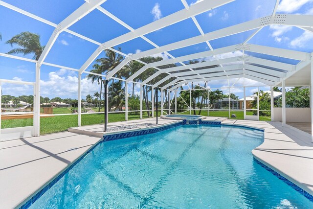 view of swimming pool with a yard, a lanai, and a patio