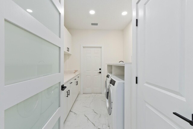 laundry room with washer and dryer