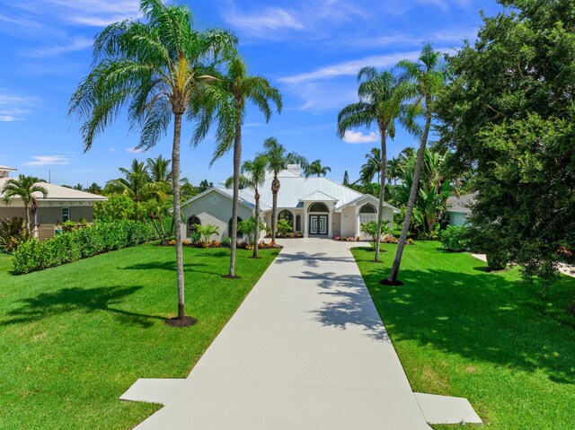 view of property's community with a lawn