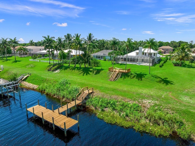 view of dock featuring a yard and a water view