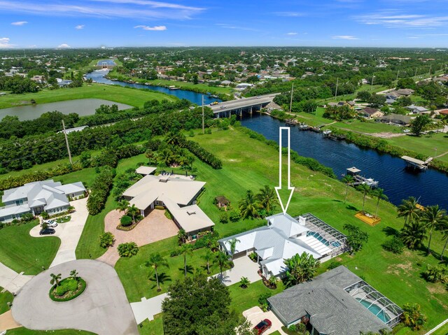 birds eye view of property featuring a water view