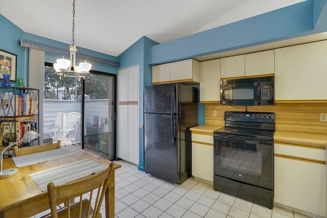 kitchen featuring black appliances, vaulted ceiling, an inviting chandelier, and light tile patterned floors