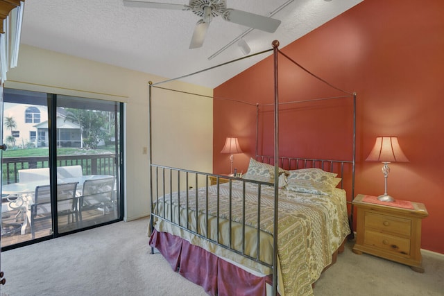 bedroom featuring multiple windows, light colored carpet, access to exterior, and ceiling fan