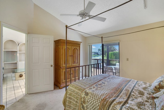 bedroom with vaulted ceiling, light carpet, access to exterior, ceiling fan, and a textured ceiling