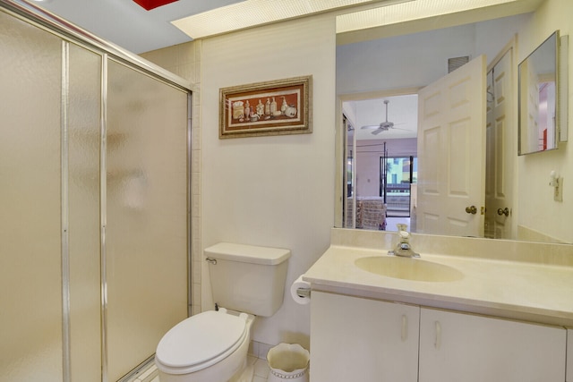 bathroom featuring tile patterned flooring, an enclosed shower, toilet, ceiling fan, and vanity