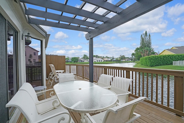 wooden terrace with a water view and a pergola