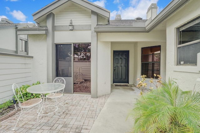 property entrance with a patio area