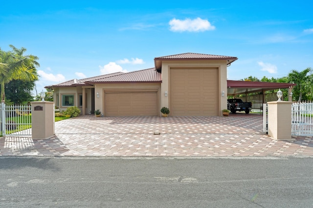 view of front of house featuring a garage and a carport