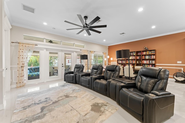 home theater room with ornamental molding and ceiling fan