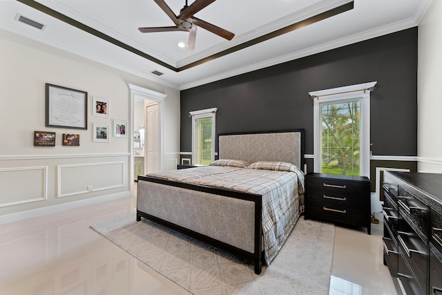 bedroom with ceiling fan, crown molding, and multiple windows