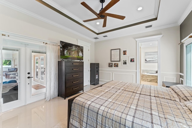 bedroom with a raised ceiling, ceiling fan, french doors, access to outside, and ornamental molding