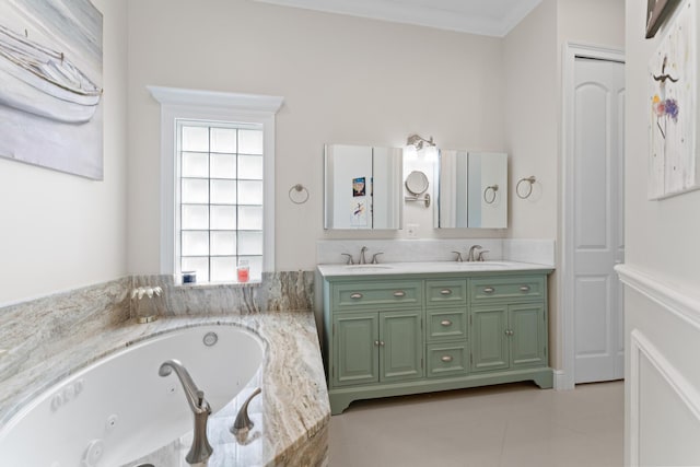 bathroom featuring tiled tub, vanity, crown molding, and tile patterned floors