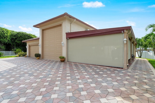 view of property exterior with a garage