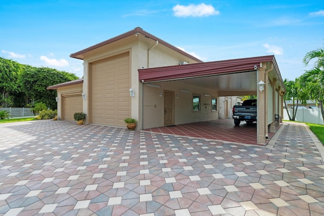 garage featuring a carport