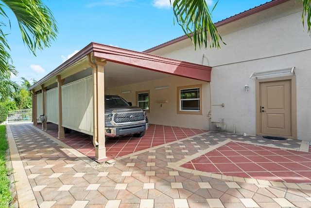 exterior space with a carport