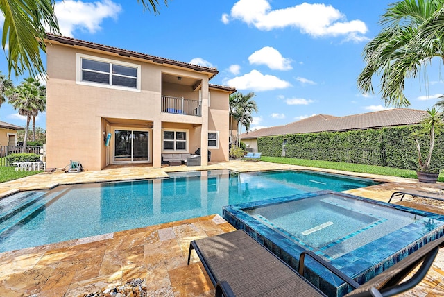 view of pool with an in ground hot tub and a patio area