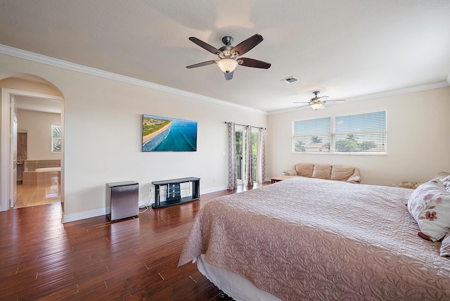 bedroom featuring ornamental molding, ensuite bathroom, ceiling fan, and dark hardwood / wood-style floors