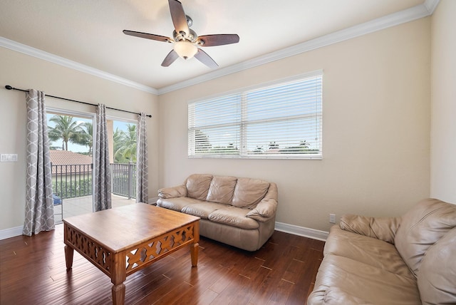 living room with crown molding, dark hardwood / wood-style floors, and ceiling fan