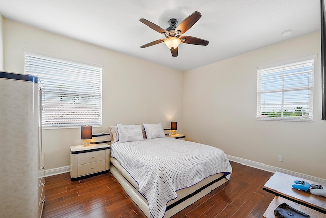 bedroom featuring dark hardwood / wood-style flooring and ceiling fan