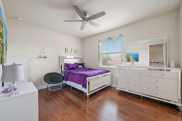 bedroom with dark wood-type flooring and ceiling fan