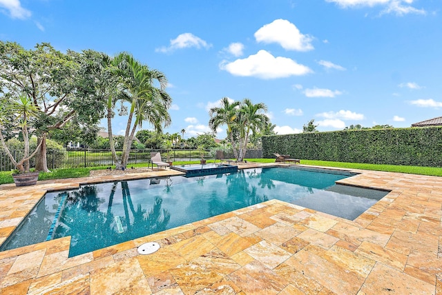 view of swimming pool with a patio area