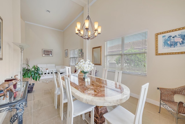 tiled dining space with high vaulted ceiling, crown molding, and an inviting chandelier