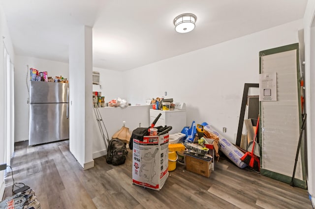 kitchen featuring hardwood / wood-style floors and stainless steel refrigerator