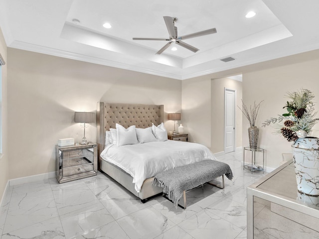 bedroom featuring ceiling fan, crown molding, and a tray ceiling