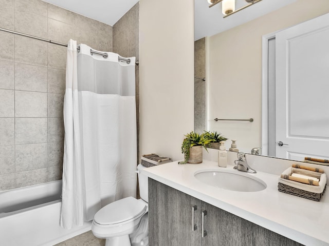 full bathroom featuring shower / bath combination with curtain, vanity, and toilet