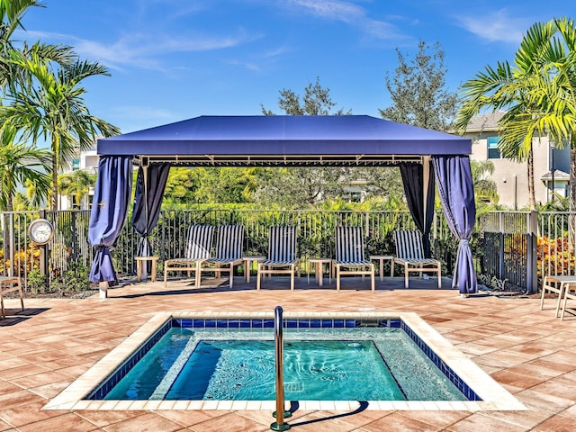 view of pool featuring a gazebo, a patio, and a community hot tub