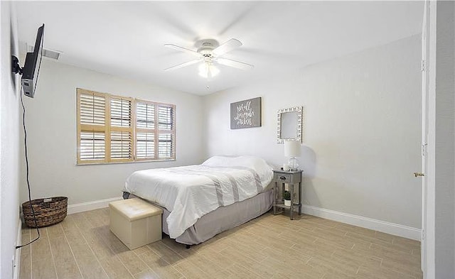 bedroom featuring light hardwood / wood-style flooring and ceiling fan