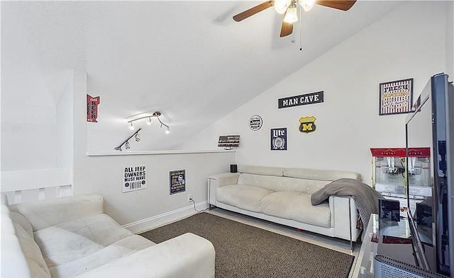 carpeted living room with lofted ceiling and ceiling fan