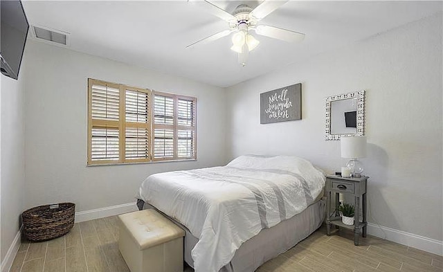 bedroom featuring light hardwood / wood-style flooring and ceiling fan