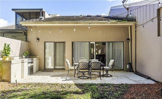 rear view of house featuring a patio