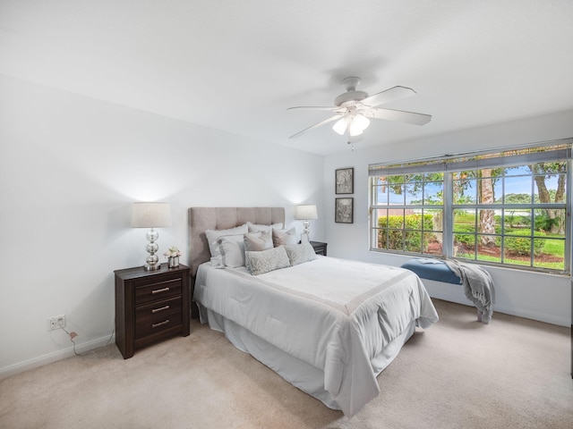 living room featuring ceiling fan and light tile patterned floors