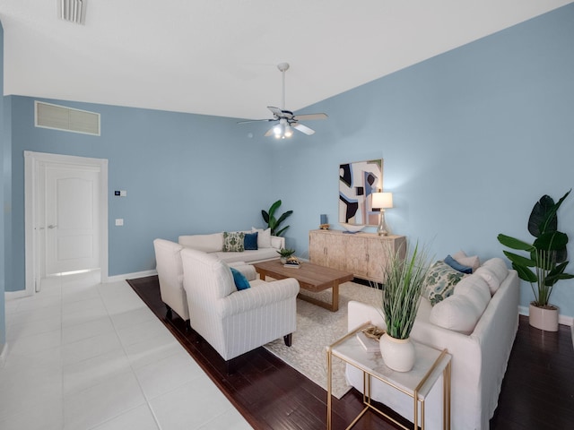 living room with high vaulted ceiling, light hardwood / wood-style floors, and ceiling fan