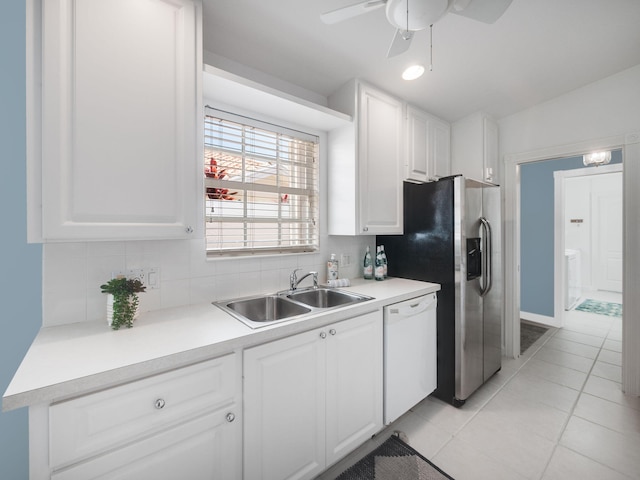 kitchen featuring ceiling fan, white cabinets, sink, dishwasher, and decorative backsplash