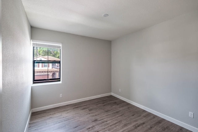 unfurnished room featuring wood-type flooring