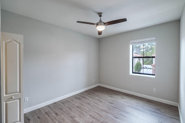 unfurnished room with light hardwood / wood-style flooring and ceiling fan