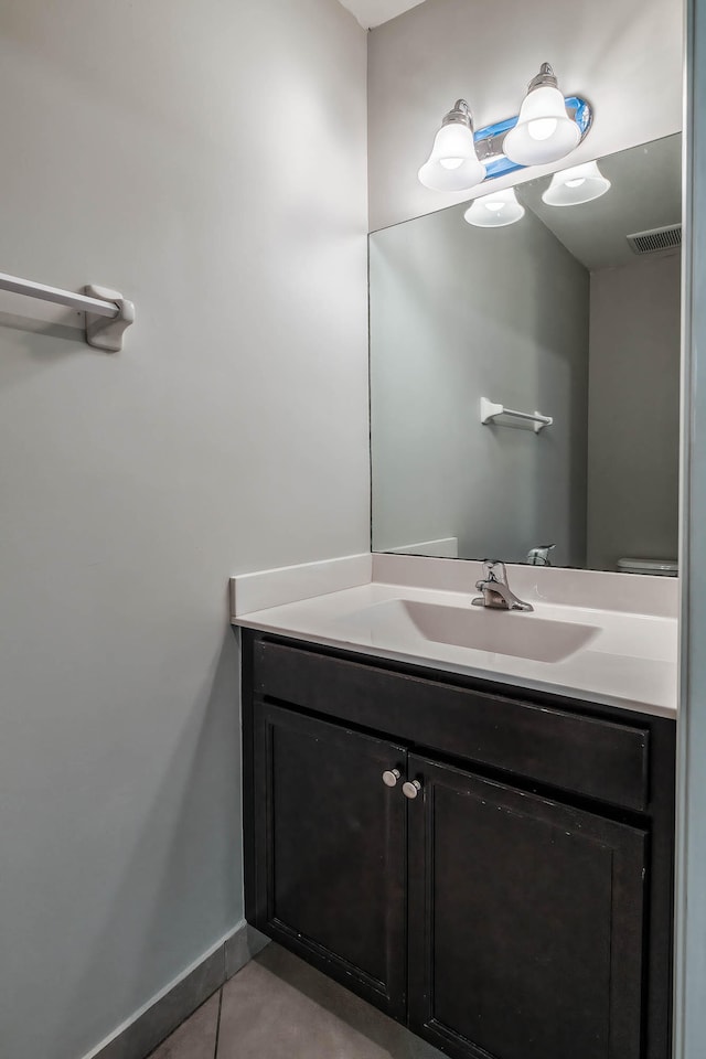 bathroom with tile patterned flooring and vanity