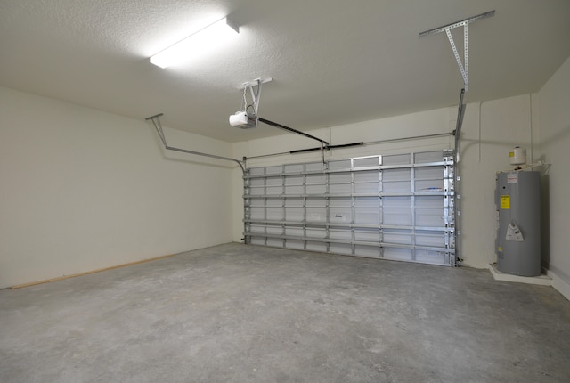 garage featuring electric water heater and a garage door opener