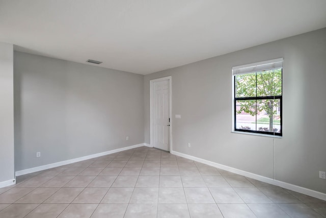 empty room with light tile patterned flooring