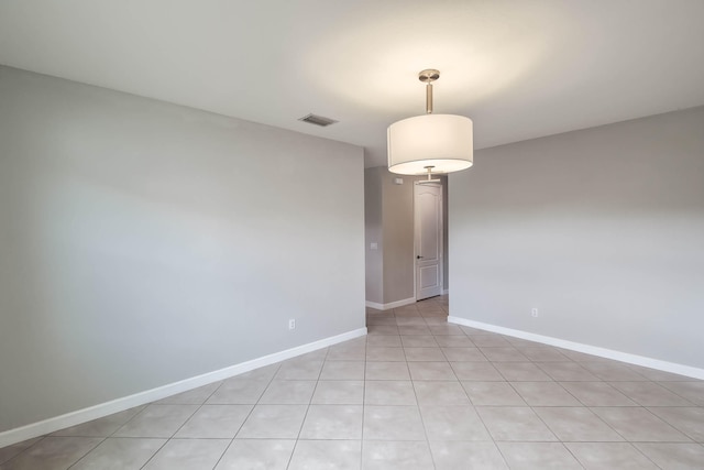 spare room with light tile patterned floors