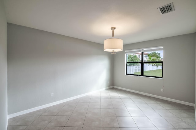 unfurnished room featuring light tile patterned floors